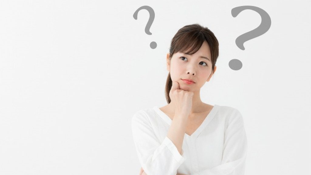 疑問の仕草をする女性